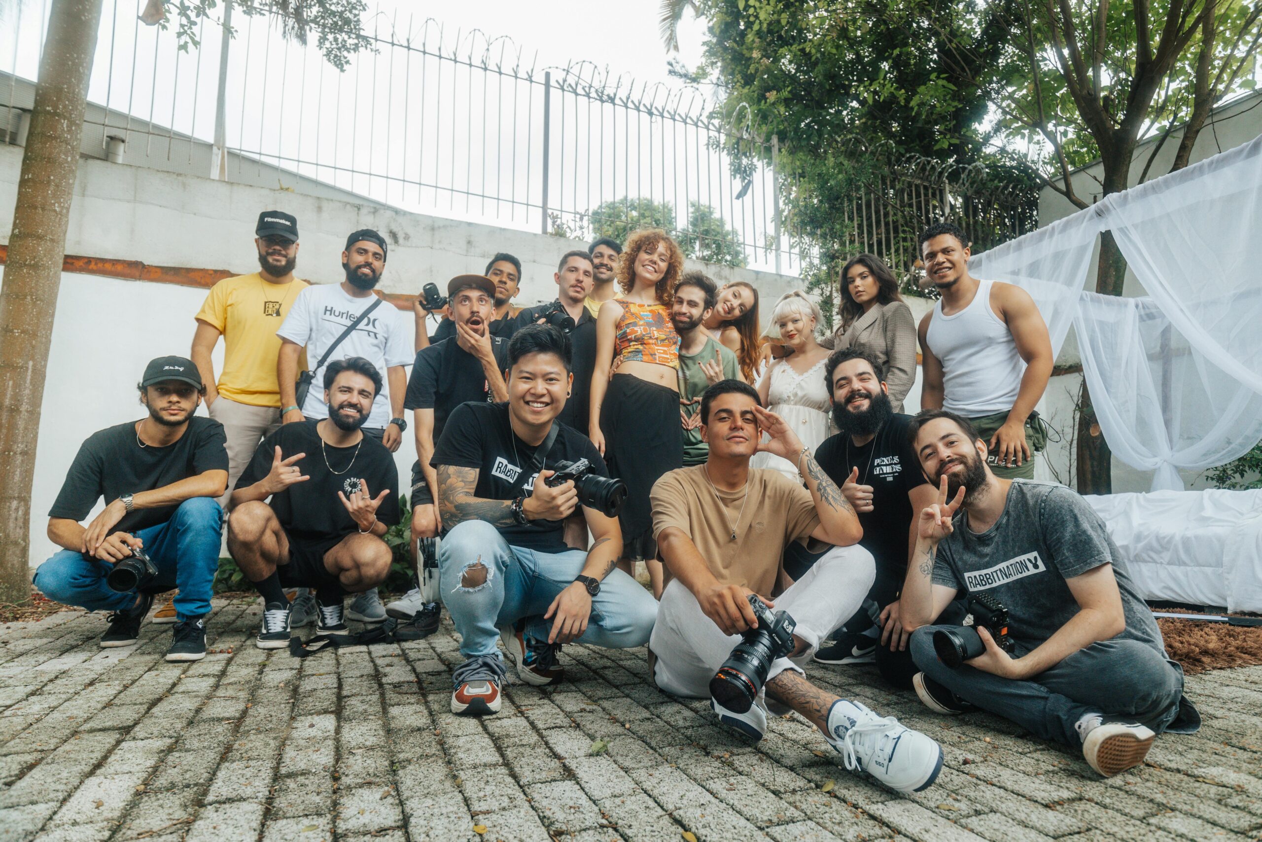 Diverse group of friends having fun and posing for a group photo outdoors in São Paulo.